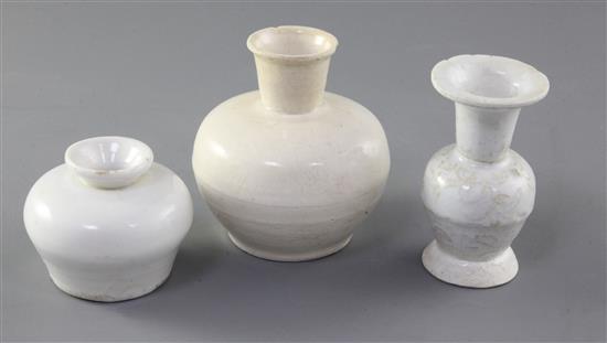 A Chinese Dehua white glazed bottle and two Dehua white glazed vases, Yuan-Ming dynasty, 5.7cm - 9.3cm